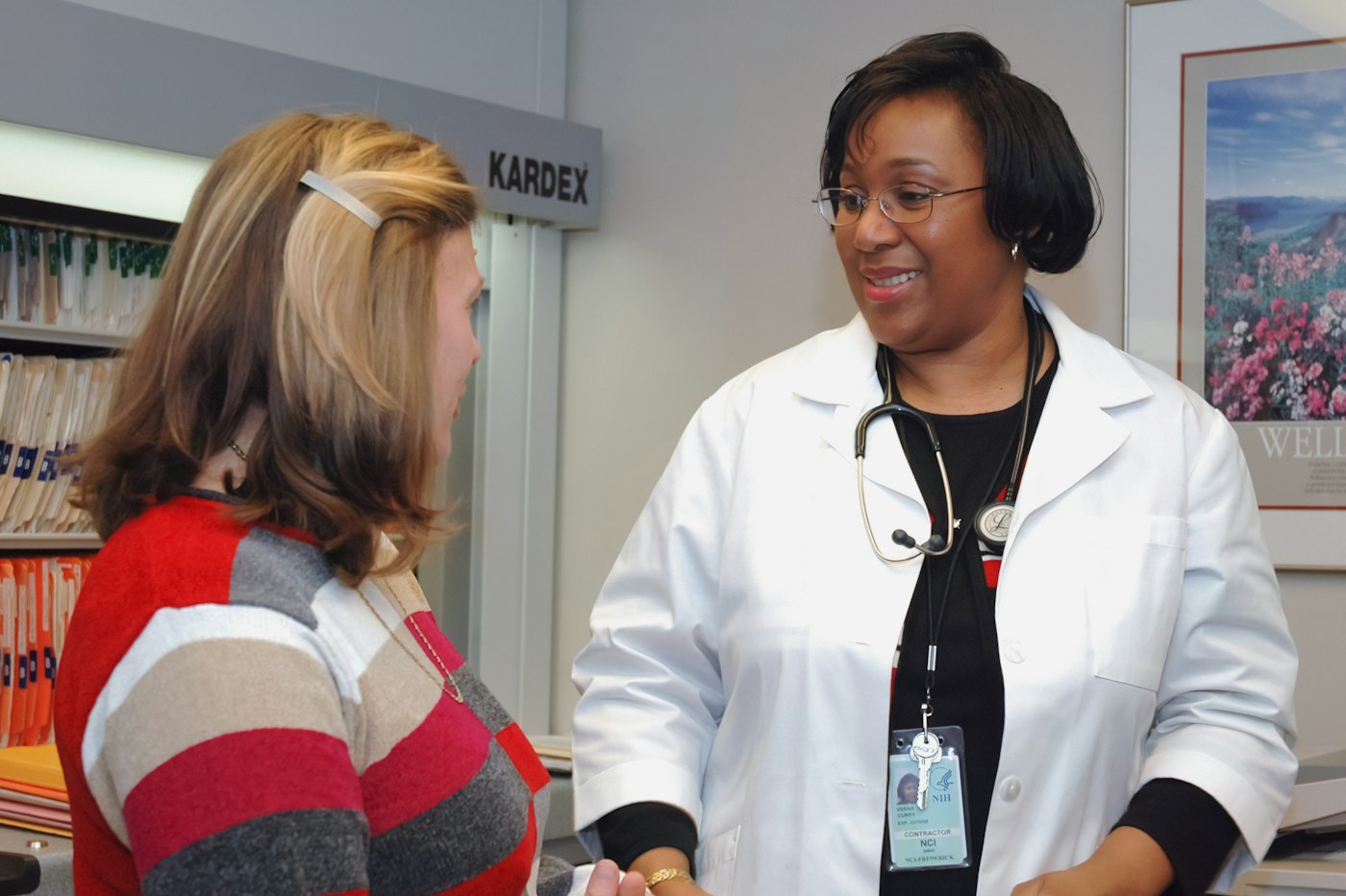 Doctor talking with a patient - health insurance