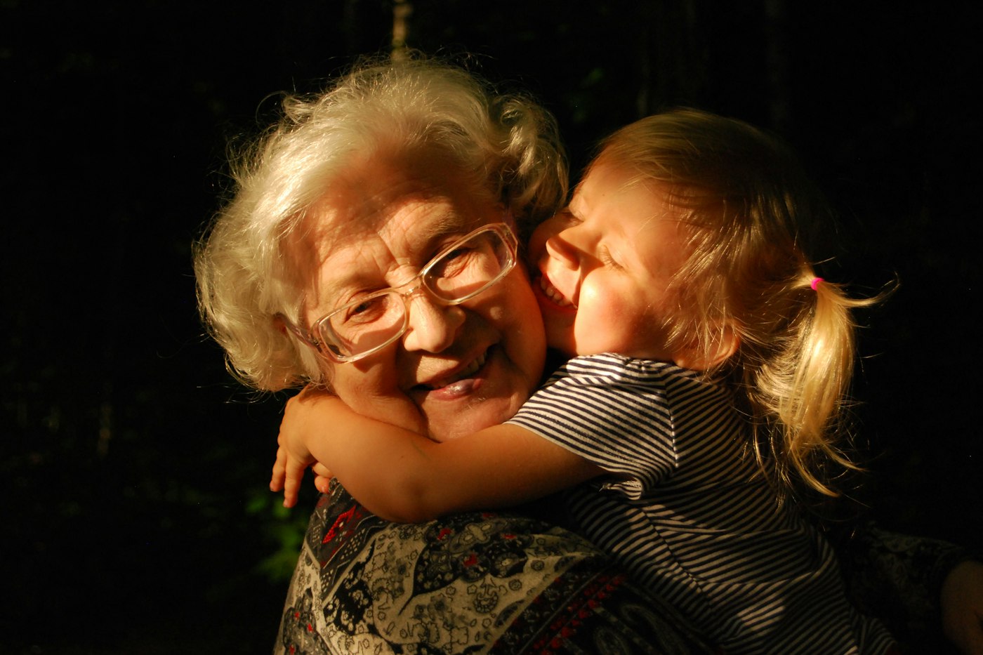 Grandmother hugging her granddaughter - trauma insurance